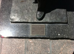 plaque on statue